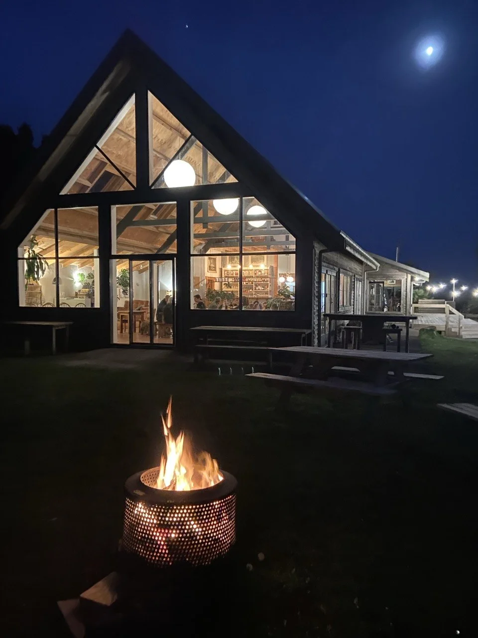 Volcanoview at night — courtyard fire and warm restaurant glow for mid-winter functions