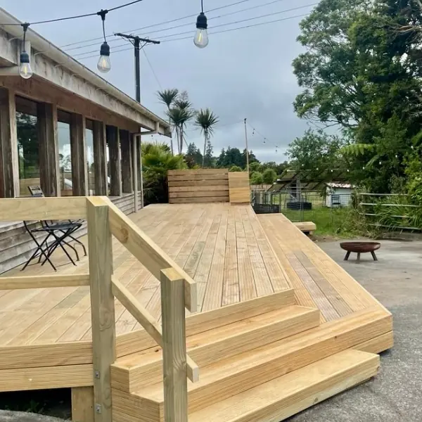 Newly built timber deck with string lights at Volcanoview restaurant, overlooking rural Taranaki countryside.